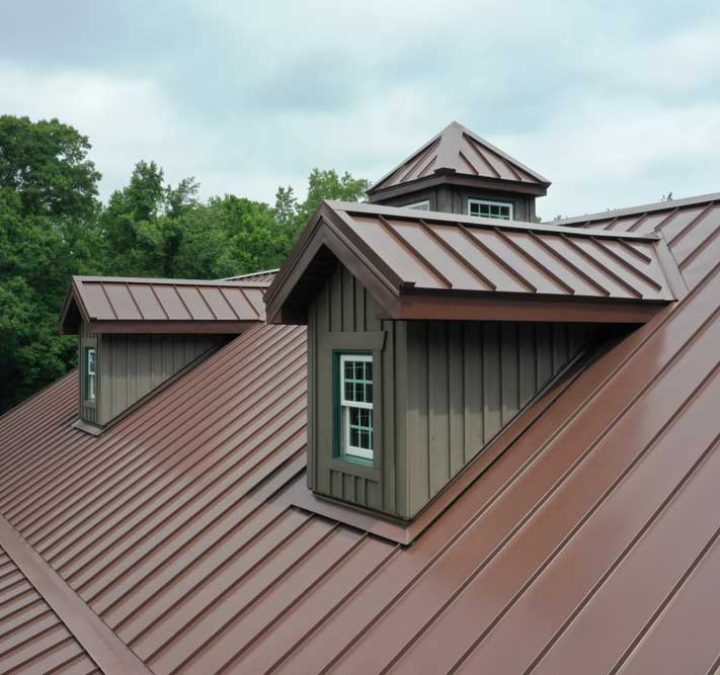 A metal roof of a residential property with dormer style roof architecture