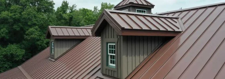 A metal roof of a residential property with dormer style roof architecture