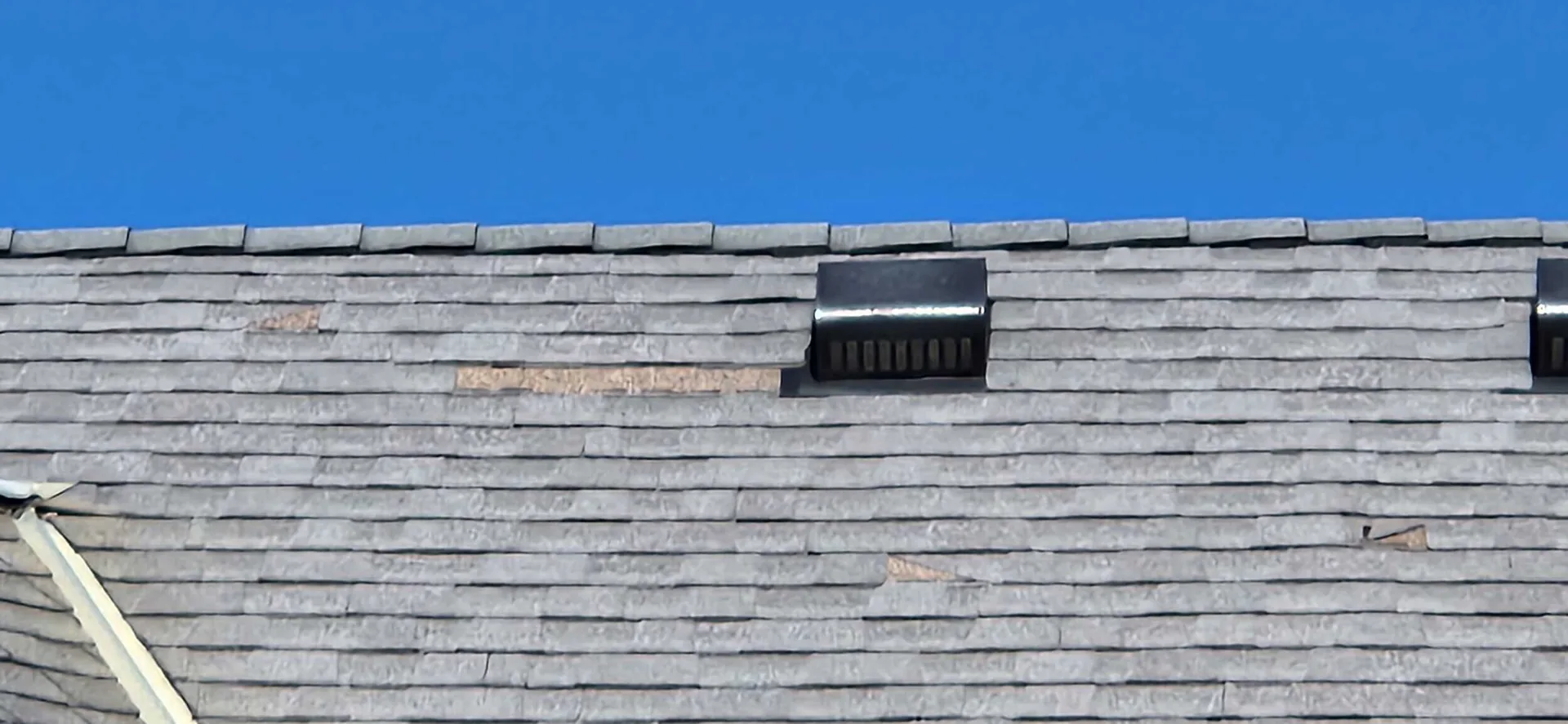 Hail-damaged roof in Farmington, MN before replacement by BN Exteriors, LLC