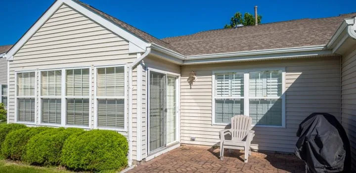 A house with a beige vinyl siding making the house look more aesthetic