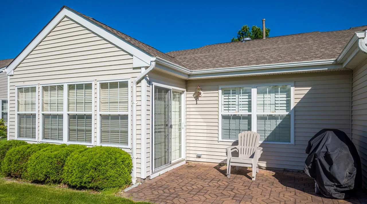 A house with a beige vinyl siding making the house look more aesthetic